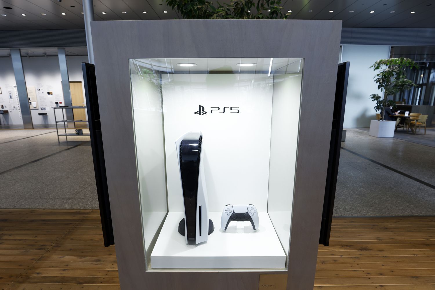 A PlayStation 5 (PS5) video game console and a controller on display at Sony's Tokyo headquarters.