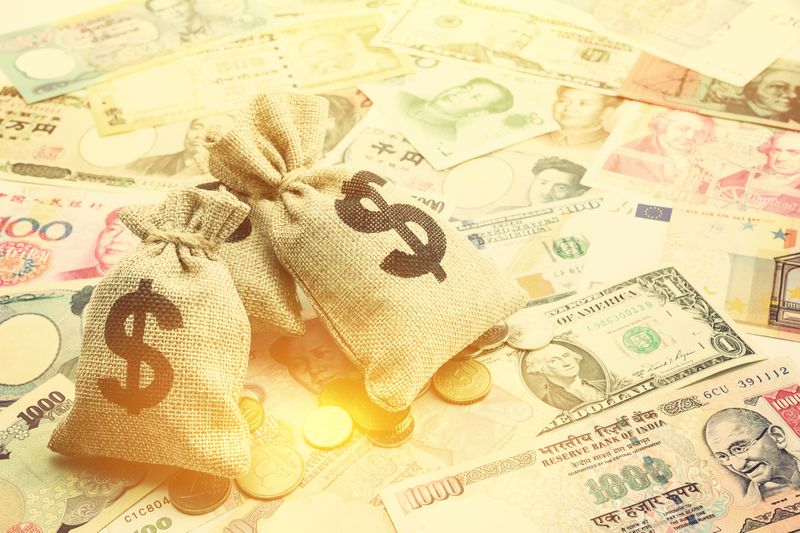 Money saving, investment and rich or wealth management concept : US dollar or cash in hemp bags or burlap sacks and coins, depicts prosperous person or millionaire has a lot of money.
