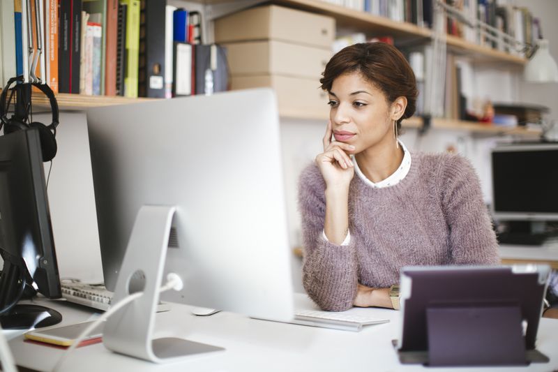 Woman reading about education loans on her computer