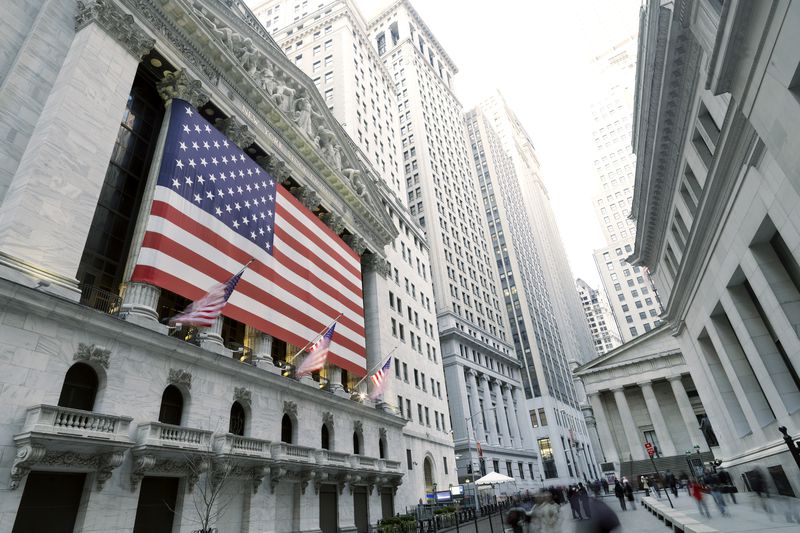 Flags are displayed on the outside of the New York Stock Exchange. 