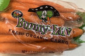 A bag of Bunny-Luv Fresh Organic Carrots, made by Grimmway Farms, sits on a table
