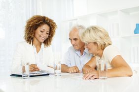 senior couple with financial planner estate planning