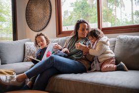 A family relaxes on a couch.