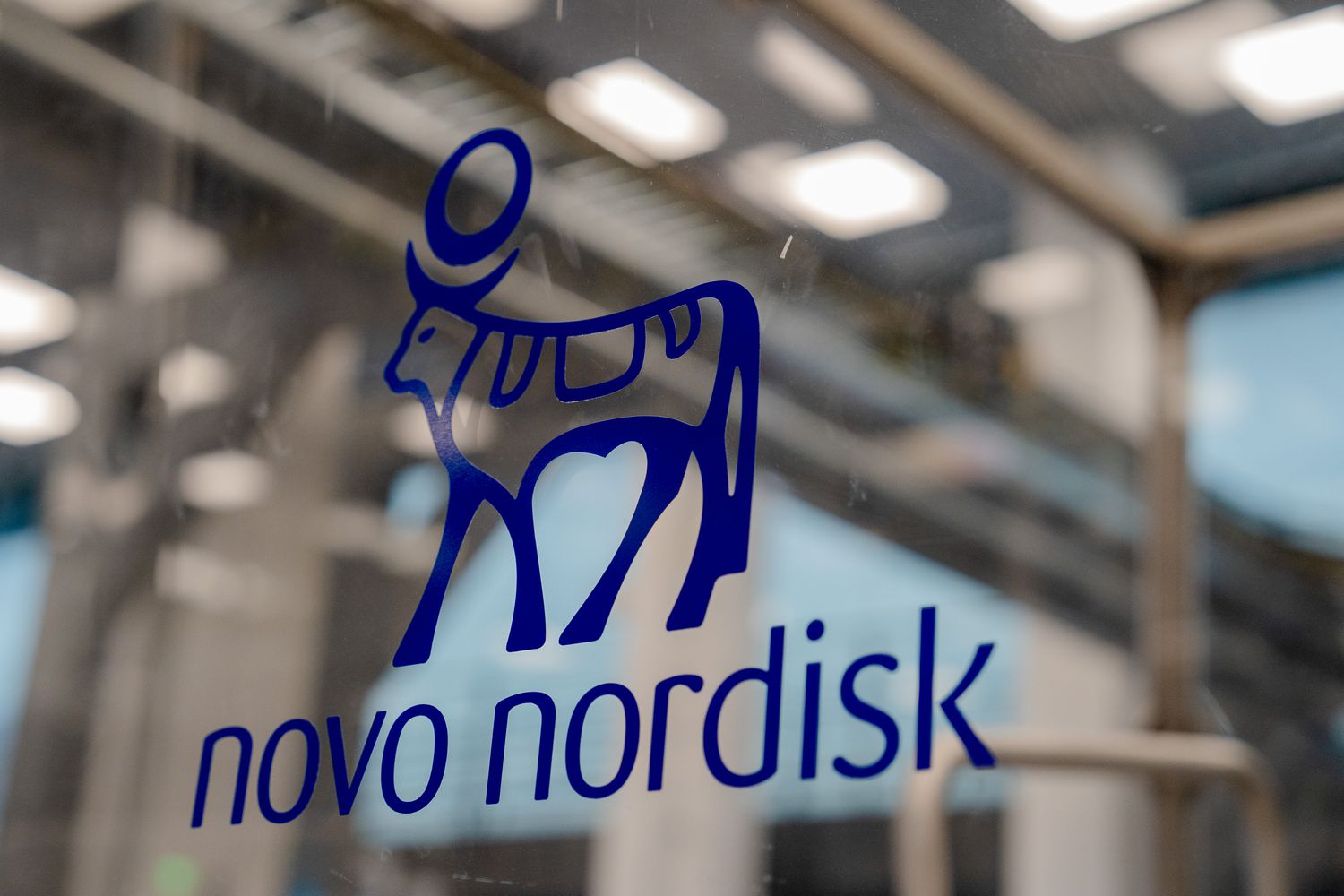 The Novo Nordisk A/S logo on a wall at their pharmaceutical manufacturing facility in Hillerod, Denmark