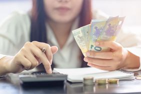 Woman Counting Money Euro Banknotes, Business or Stock Market Concept Image