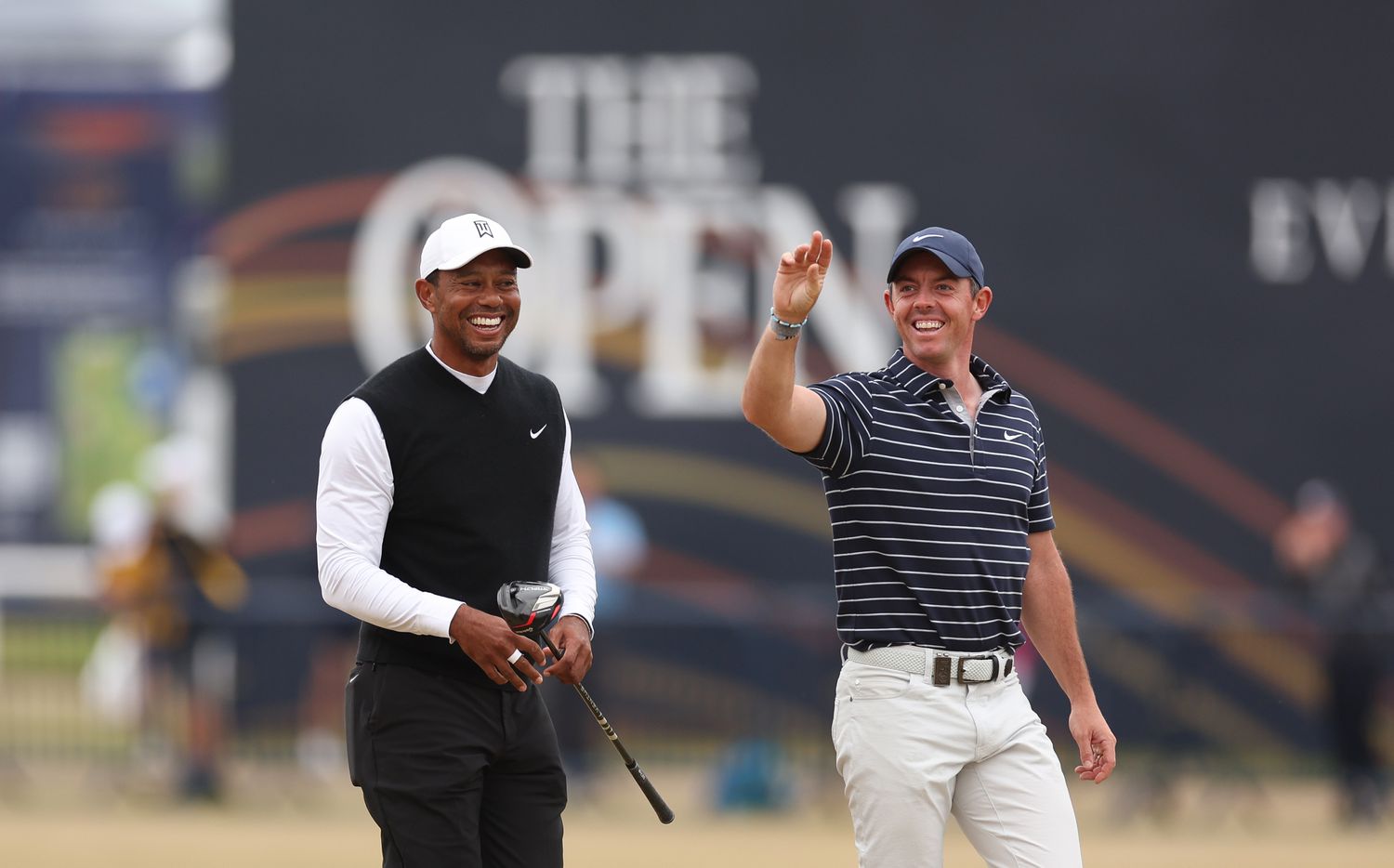 Golf greats Tiger Woods and Rory McIlroy on a course. 