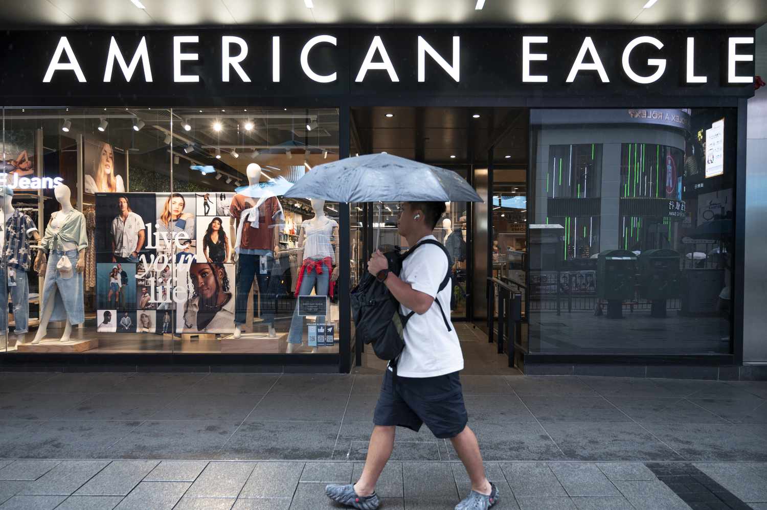A man walks past an American Eagle store in Hong Kong in May. 