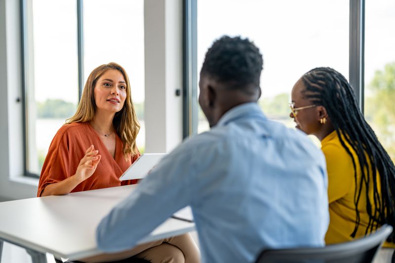 Young family talking with a lawyer