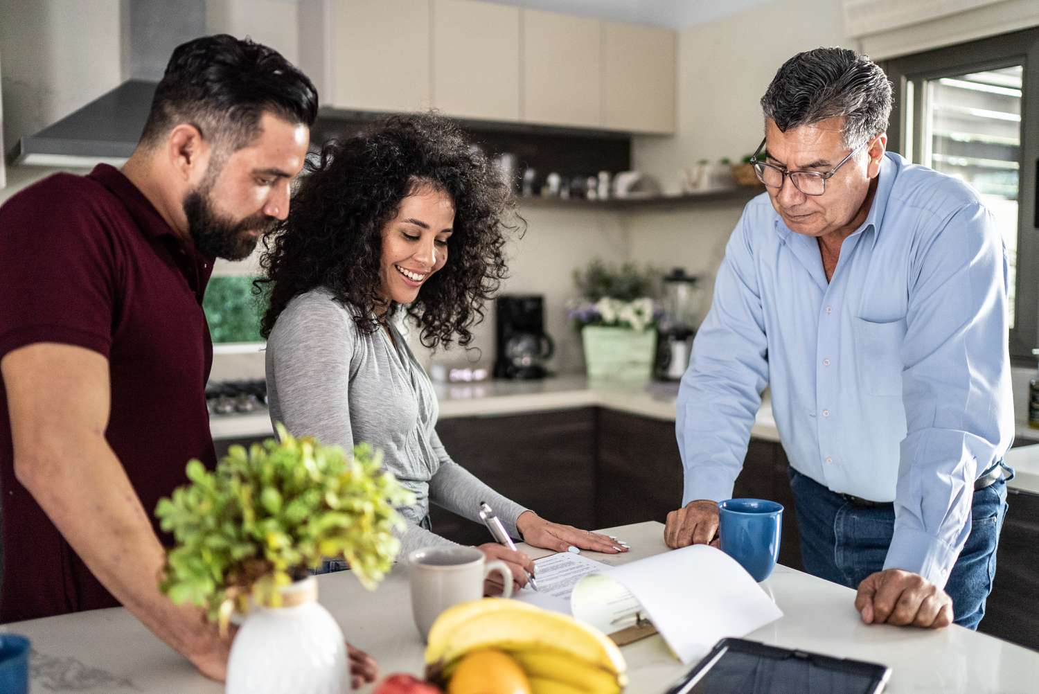 A couple signing a mortgage contract for their new home using mortgage credit certificate to make the purchase more affordable.