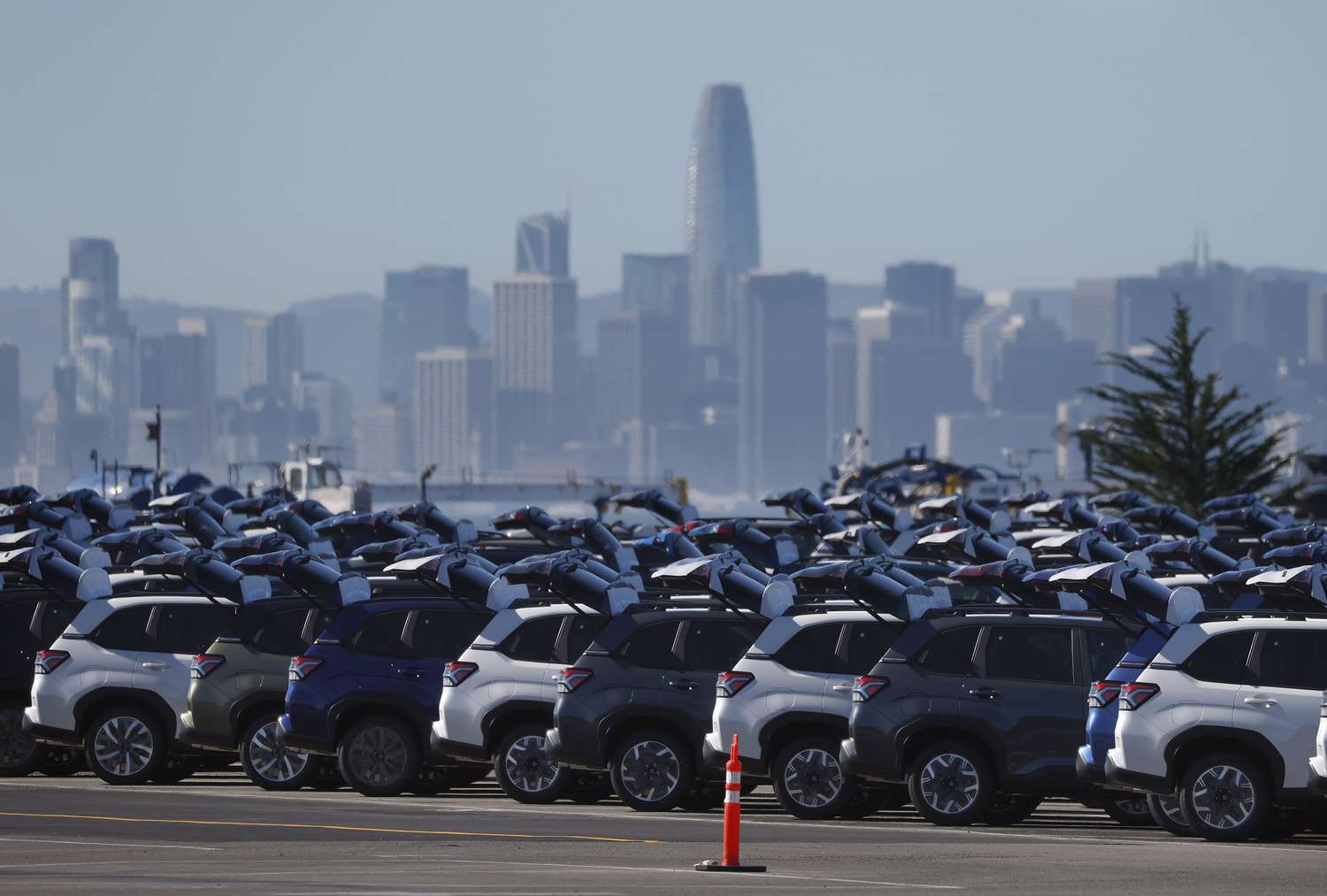 Brand new Subaru cars sit in a storage lot at Auto Warehouse Co. on March 24, 2025 in Richmond, California. 