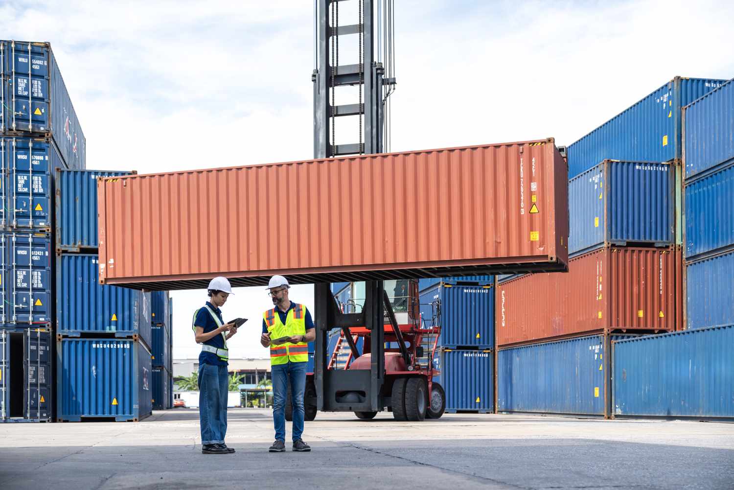 Workers with shipping containers