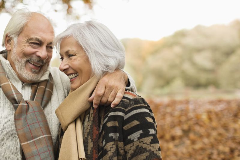 A man and a woman smiling. 