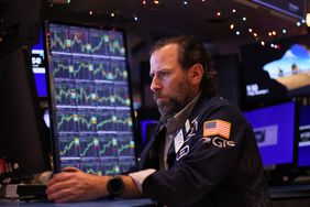 Traders work on the floor of the New York Stock Exchange.