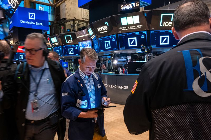 Traders work on the floor of the New York Stock Exchange
