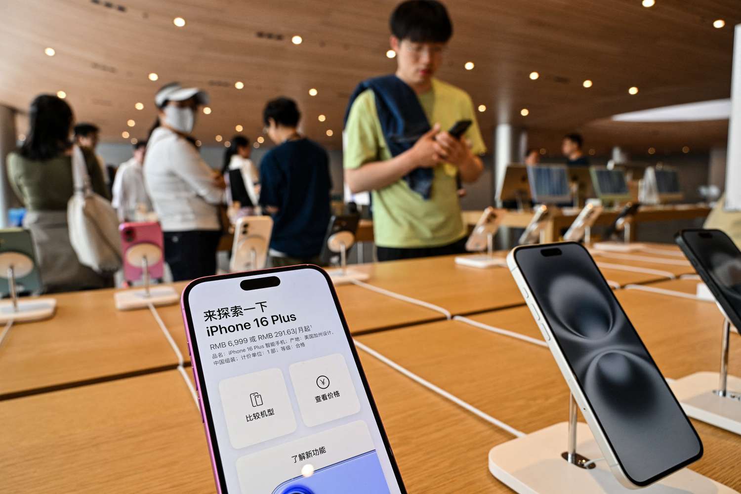 Iphone 16s are displayed in an Apple store in the Jing'an district in Shanghai on April 10, 2025