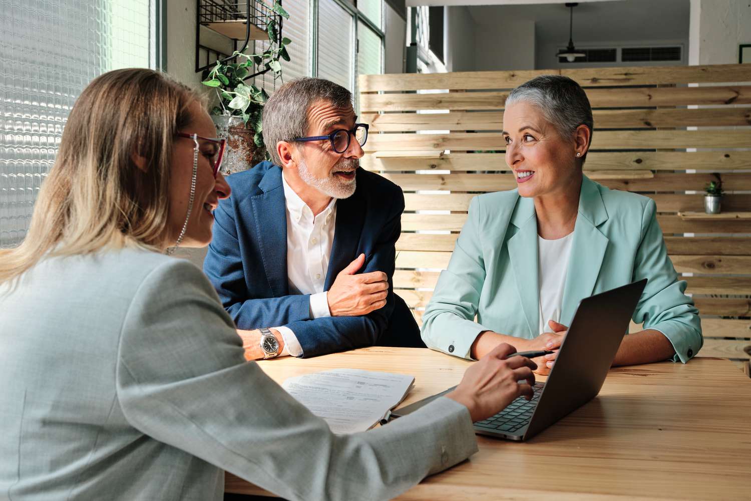 A financial advisor meeting with clients