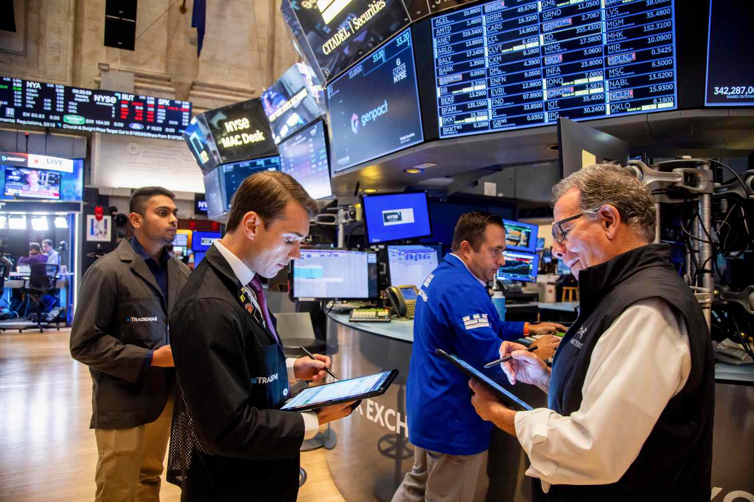 Traders work on the floor of the New York Stock Exchange