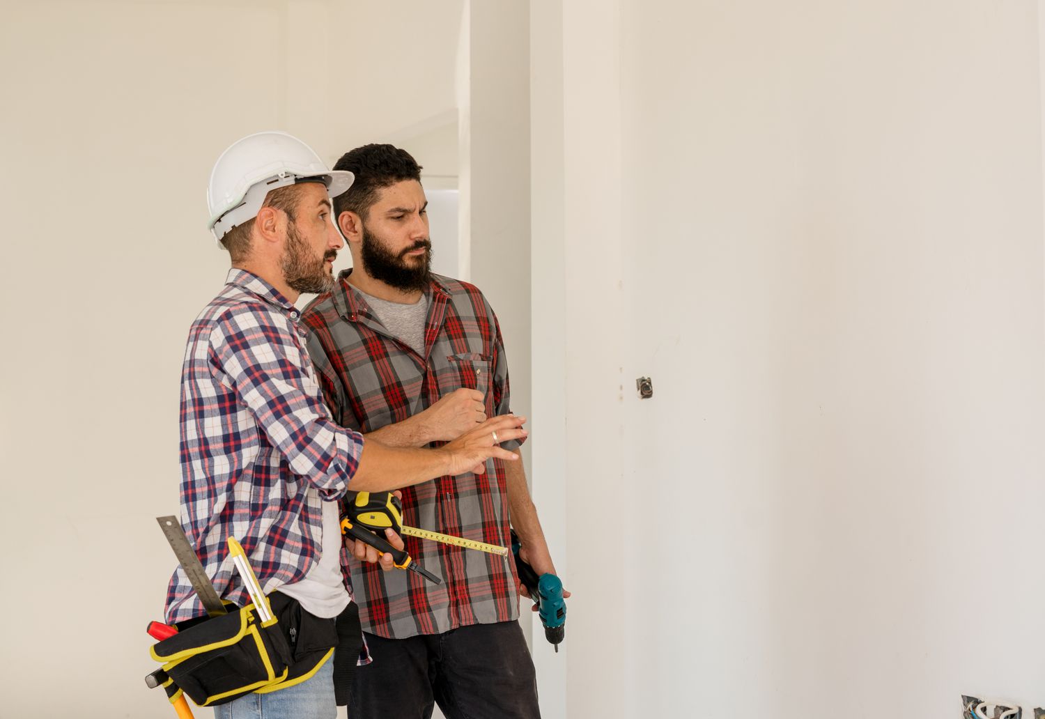 Engineer inspecting a house under construction.