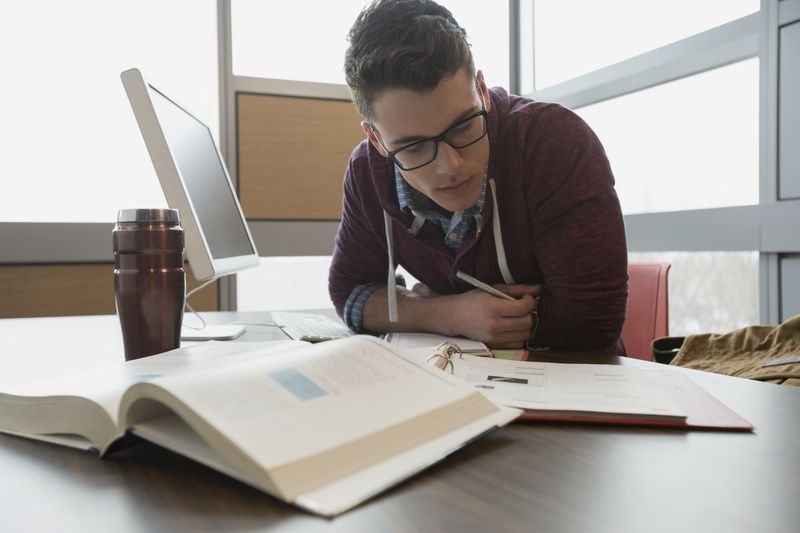 College student studying at computer