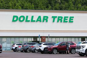 Cars are parked near a Dollar Tree store.