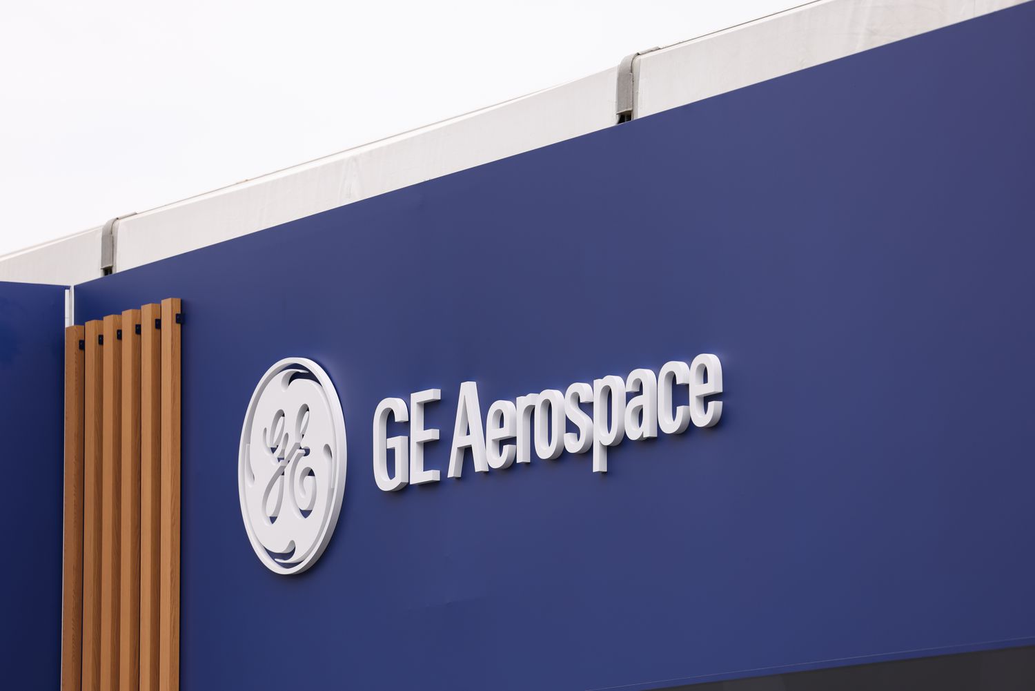 The GE Aerospace logo is seen on the side of a blue building.