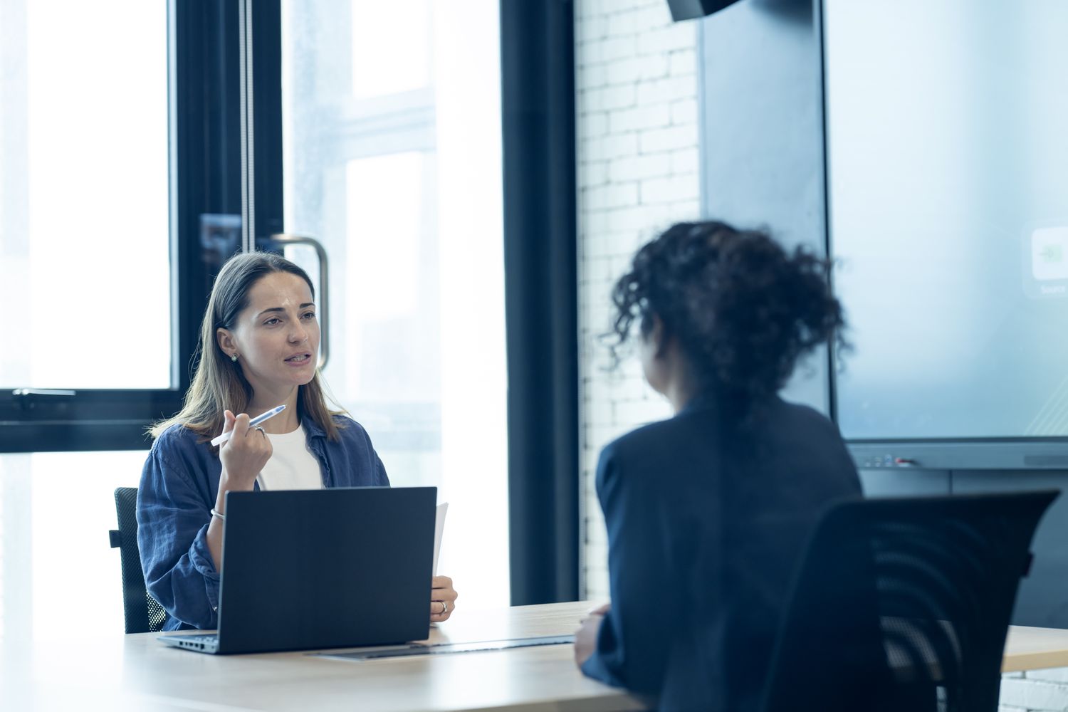 HR manager conducting an interview and considering women for a new hire 