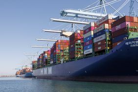 Container ships are among the few unloaded and loaded at the Port of Los Angeles on May 9, 2025 in Los Angeles, California. 