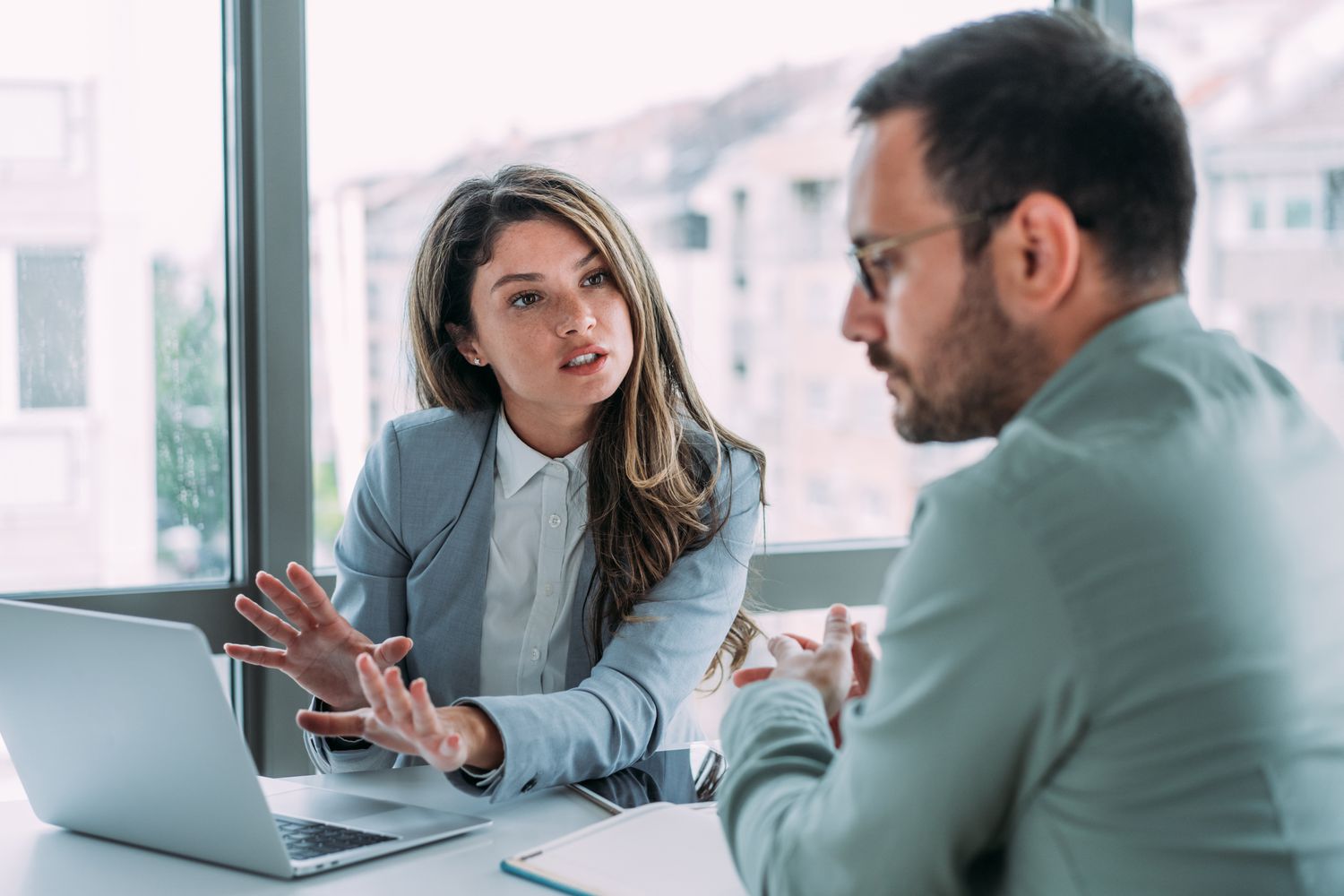 An aggressive mortgage banker trys to talk a relunctant buyer into purchasing an adjustable-rate mortgage.