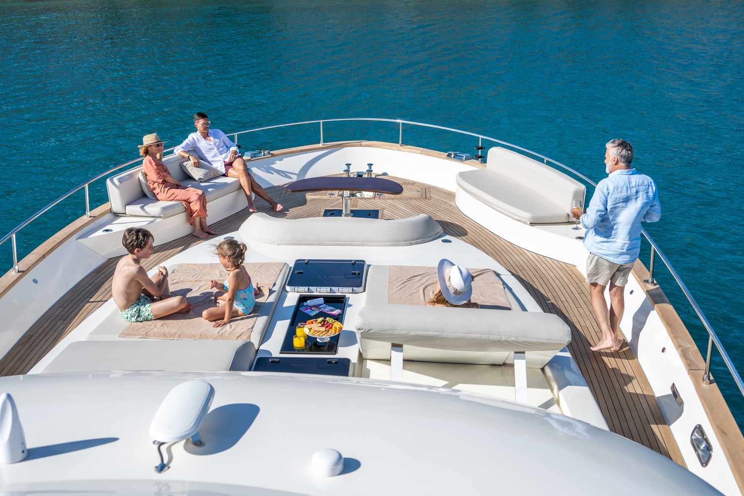 Family enjoying summer vacation on luxury yacht.