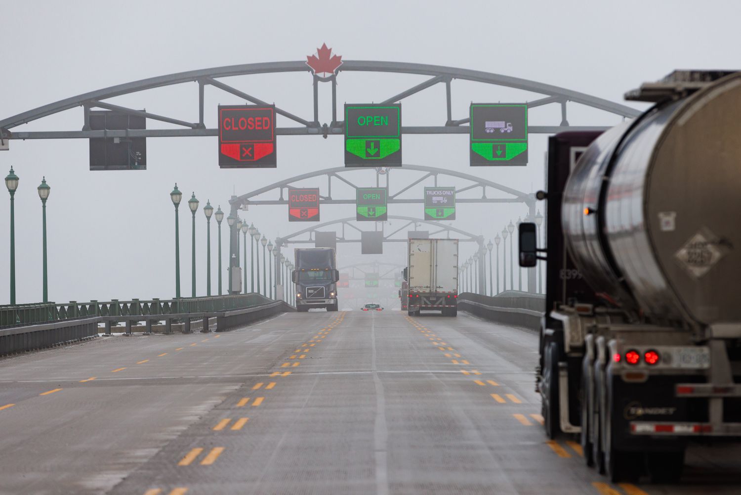 Tractor trailers cross the Peace Bridge at the Canada-US border in Fort Erie, Ontario, Canada, on Monday, Feb. 3, 2025.