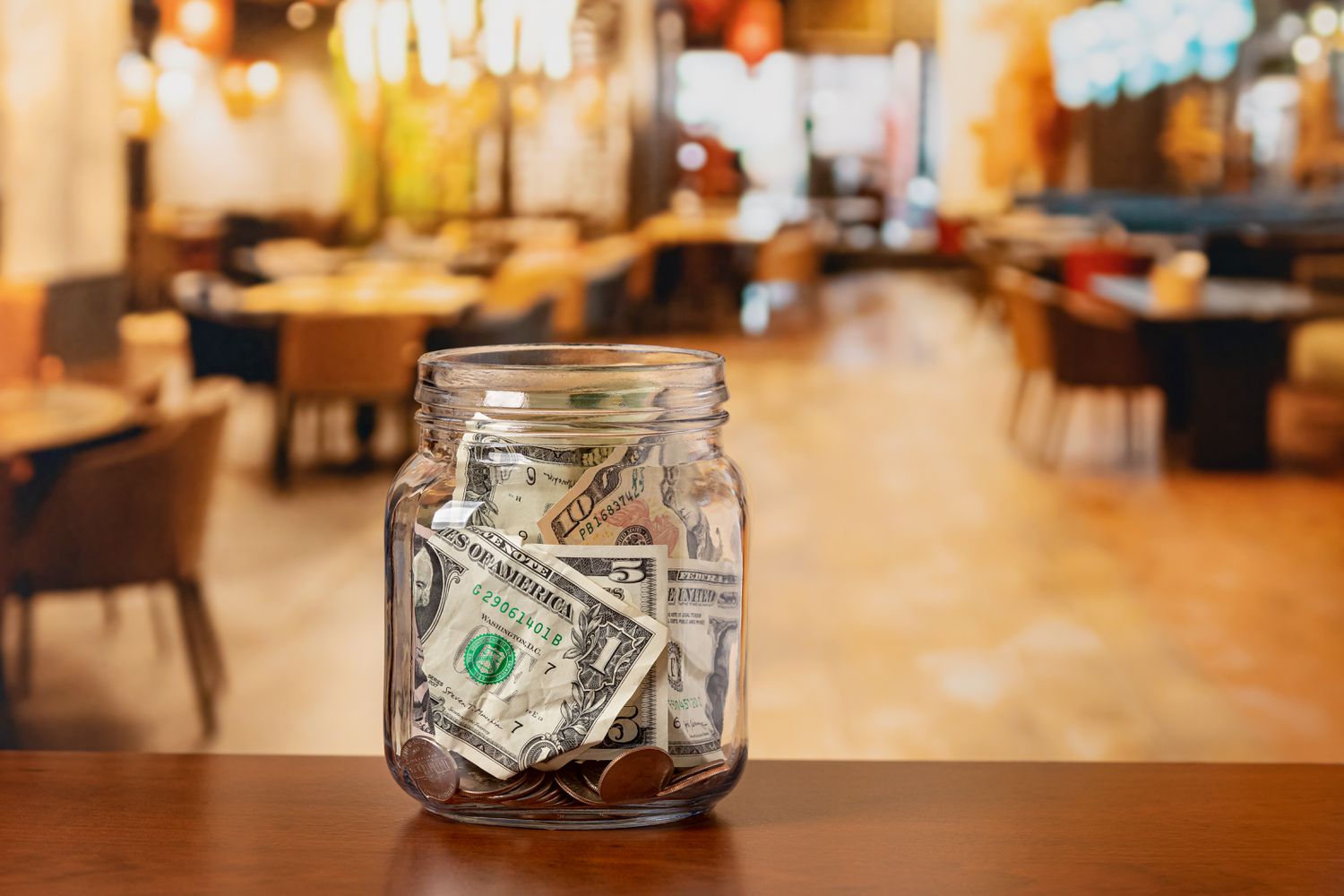 A stock image of a tip jar in a restaurant. 