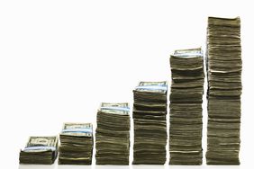 Stacks of US currency in ascending graph pattern.