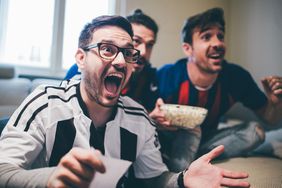 Group of men watching a game