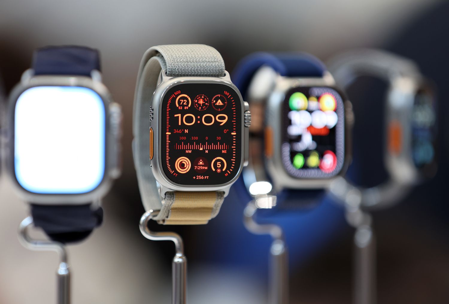 A group of Apple Watch Series 10s are displayed on stands.