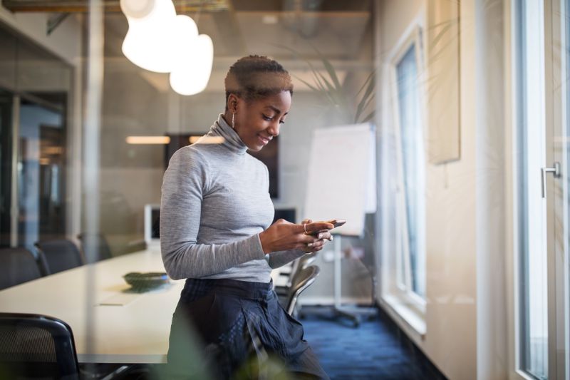 An executive uses a smart phone.