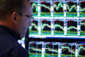 A trader works on the floor of the New York Stock Exchange.