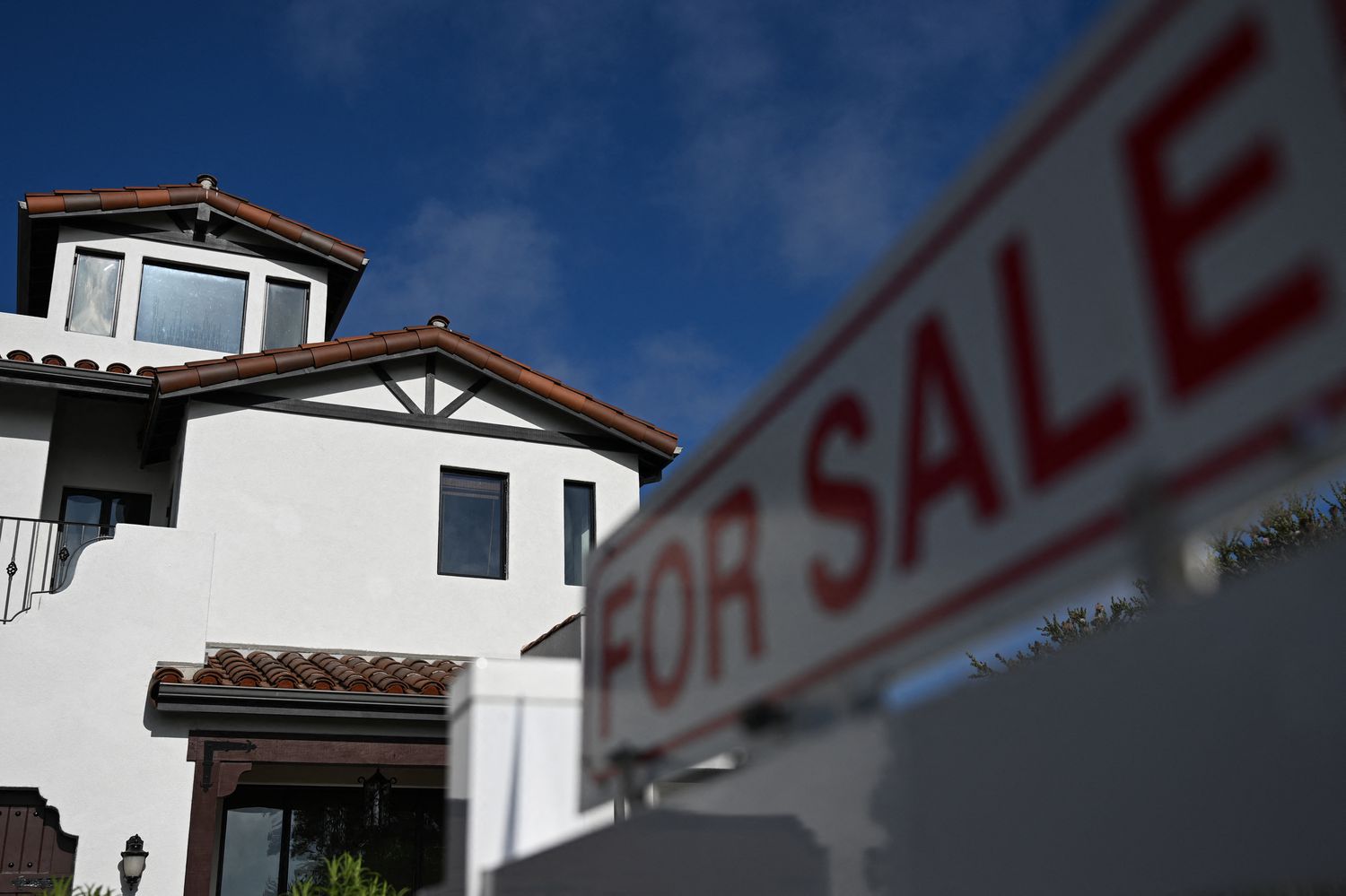 A for sale sign is displayed outside of a home for sale on August 16, 2024 in Los Angeles, California.