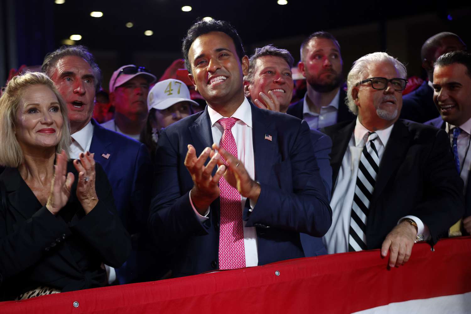 Vivek Ramaswamy (C) joins other supporters for an election night party with Republican presidential nominee, former U.S. President Donald Trump at the Palm Beach Convention Center on November 06, 2024 in West Palm Beach, Florida.