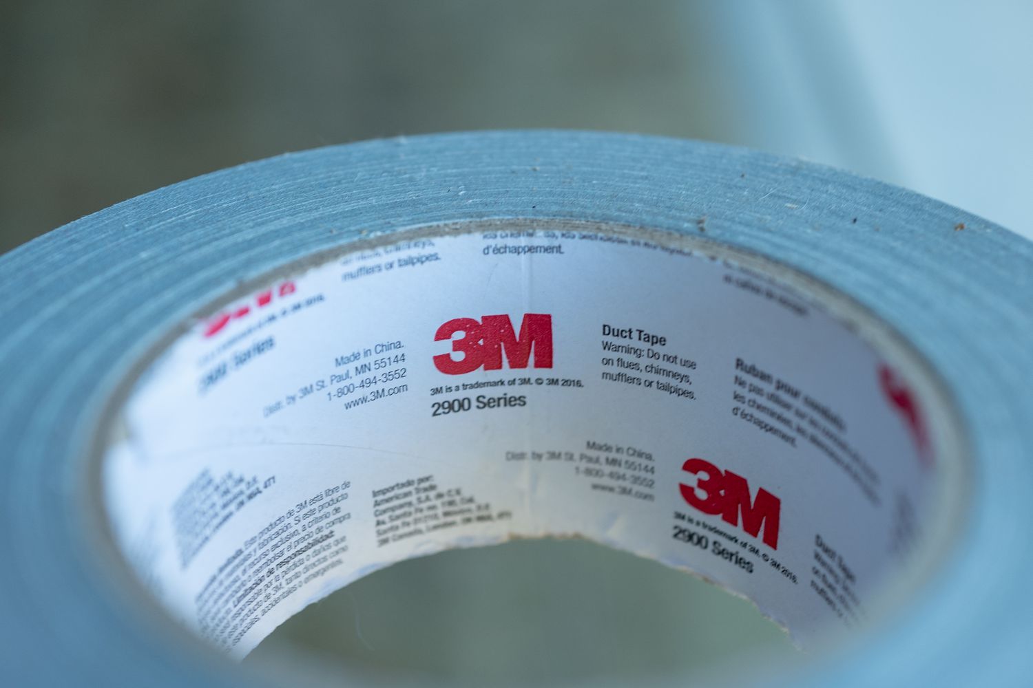 Close-up of logo for American conglomerate 3M on roll of tape.