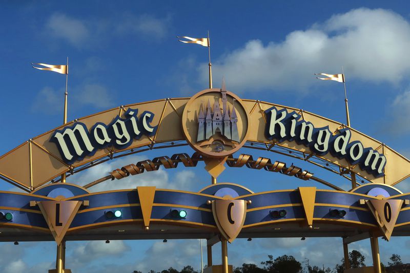 A sign for the Magic Kingdom hangs above the entrance to the grounds of the park at Walt Disney World on April 3, 2025, in Orlando, Florida