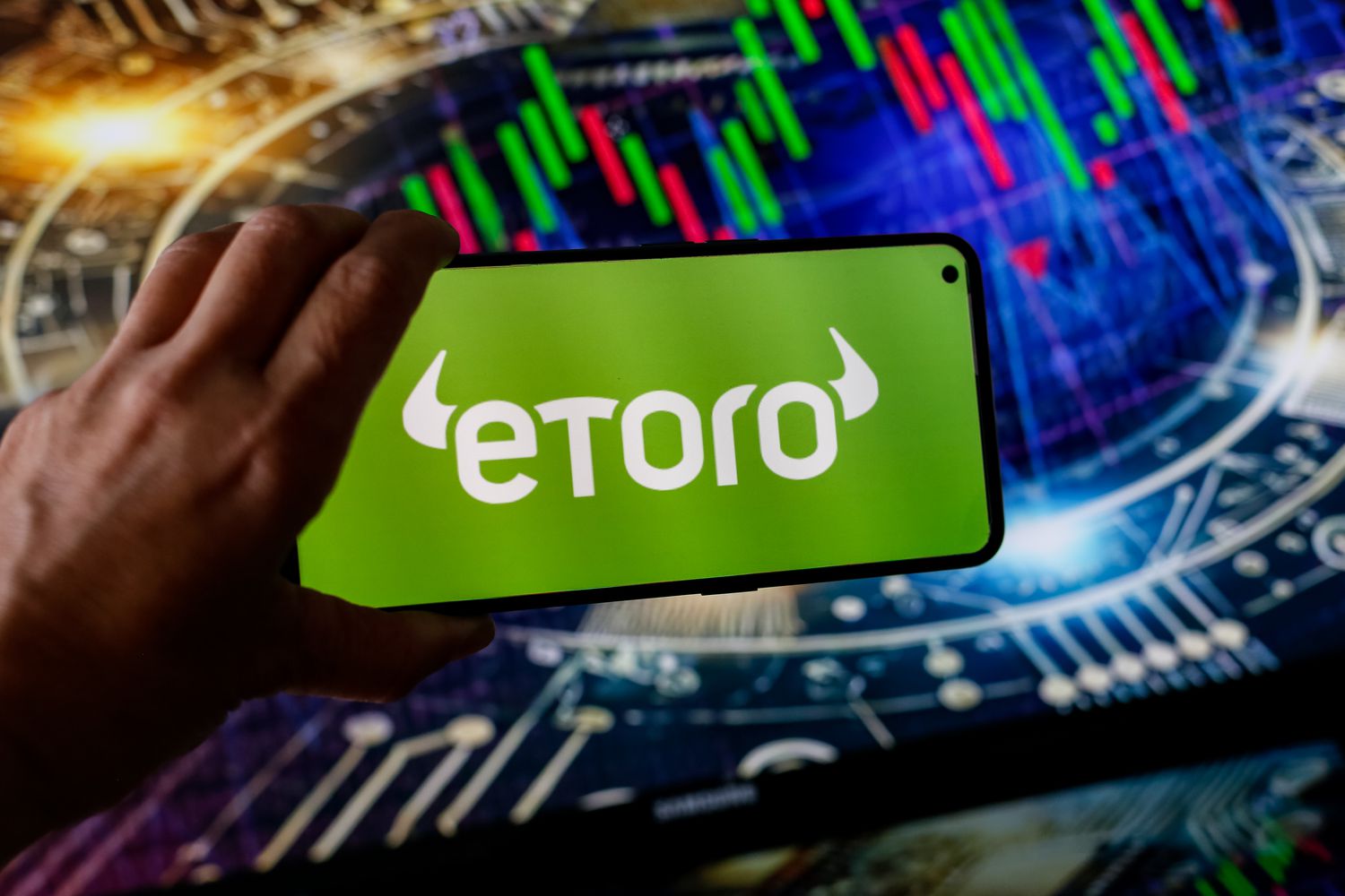 The eToro logo displayed on a smartphone screen