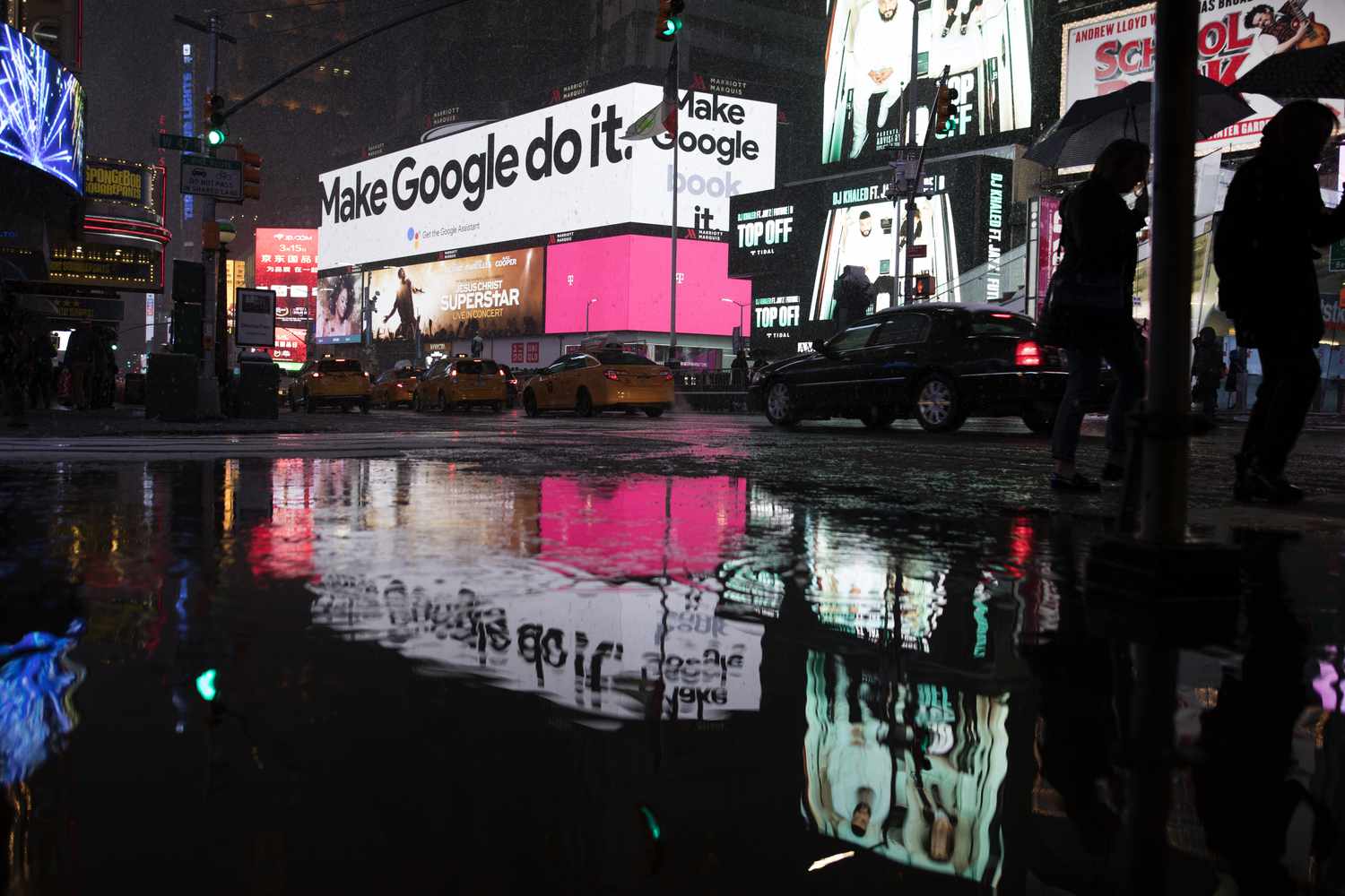 The google advert in Time Square during a deluge from Winter Storm Quinn in Time Square, Manhattan.
