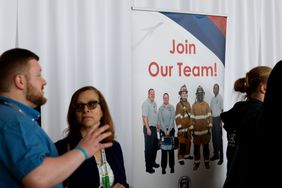 "Join Our Team" signage during a job fair hosted by the Metropolitan Washington Airports Authority to support federal workers looking for new career opportunities