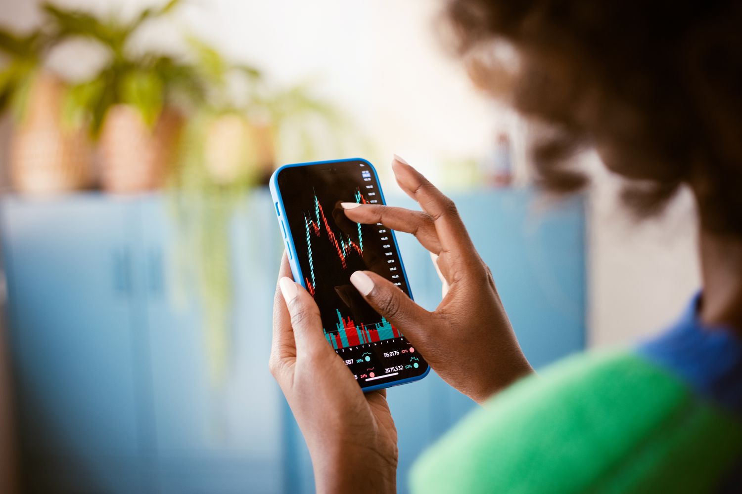 Person checking stock price on smart phone