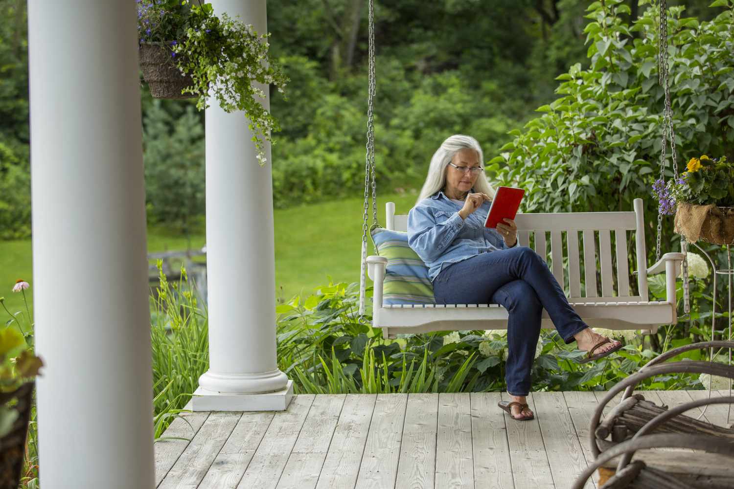 Older adult reading on her tablet about how to finance aging in place