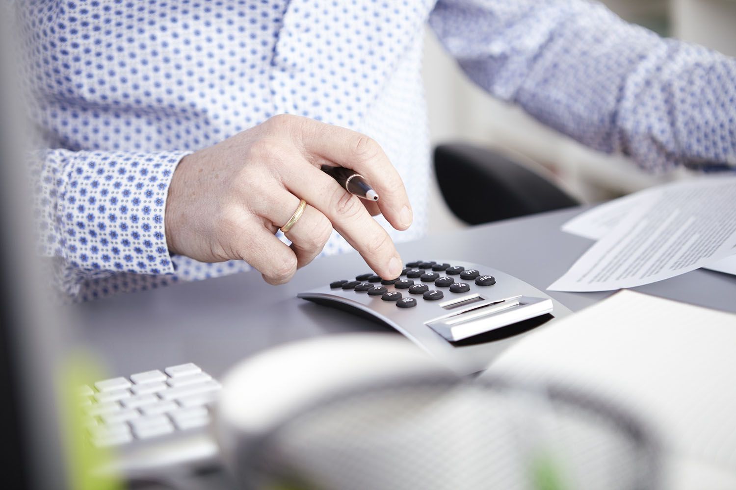 A worker using a calculator