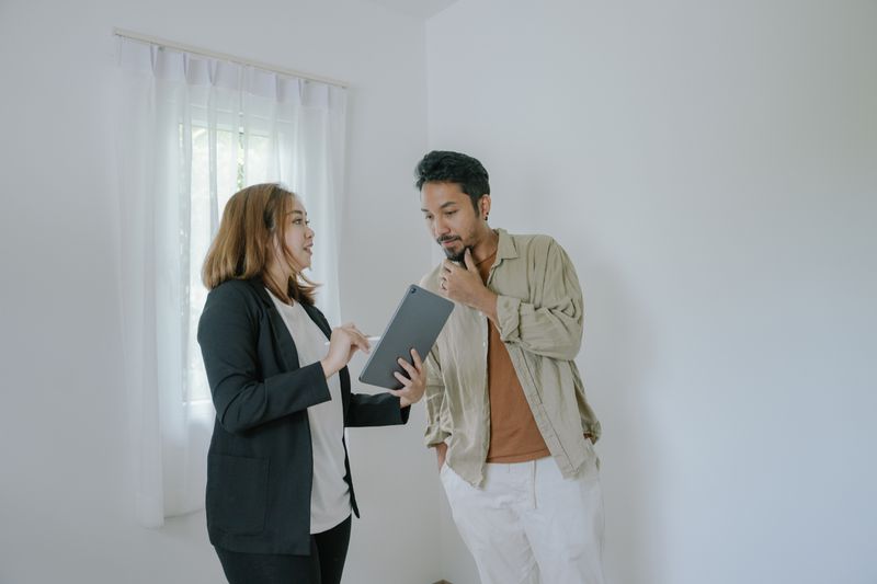 Inspector going over a property with a homebuyer.