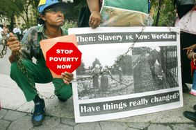 Protester Andy Thomas participates in a demonstration against welfare reform in Union Square August 22, 2002 in New York City. 