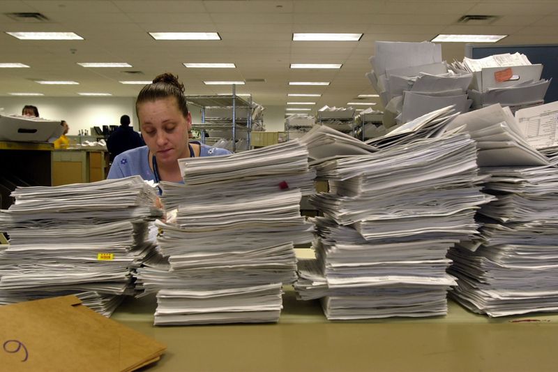 IRS Office with Paperwork Mountain