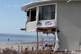 A home that was damaged by Hurricane Milton is seen on October 13, 2024 in Manasota Key, Florida. People continue recovering following the storm that made landfall as a Category 3 hurricane in the Siesta Key area of Florida on October 9th, causing damage and flooding throughout Central Florida.
